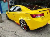 Bán Kia Cerato Koup 2.0 AT sản xuất năm 2009, màu vàng, xe nhập, 355 triệu giá 355 triệu tại Tp.HCM